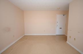 Stoney Creek apartment for rent - A room with a white door and a white baseboard heater.