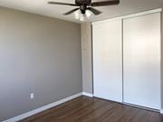 Hamilton apartment for rent - A room with a ceiling fan and a white closet.