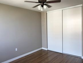 Hamilton apartment for rent - A room with a ceiling fan and a white closet.
