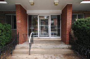 Hamilton apartment for rent - The front door of a building with the number 55 on it.