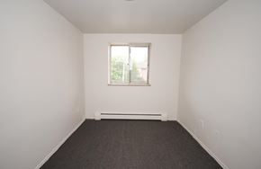 Hamilton apartment for rent - A room with a window and a radiator on the floor.