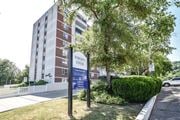 Stoney Creek apartment for rent - A sign for Robinson Towers stands in front of a brick building.