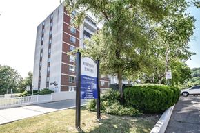 Stoney Creek apartment for rent - A sign for Robinson Towers stands in front of a brick building.