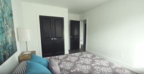 Waterloo apartment for rent - A bedroom with a bed and a dresser.