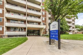 Stoney Creek apartment for rent - A sign for Evelyn Court is in front of a building.