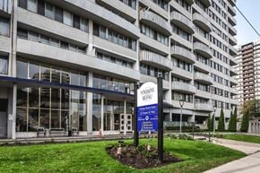 Hamilton apartment for rent - A large building with a sign in front that says "Pontiane Bleu".
