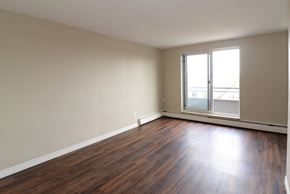 Hamilton apartment for rent - A room with wooden floors and a window.