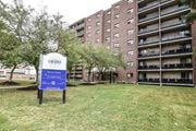 Kitchener apartment for rent - A sign in front of a building that says Grand Renewal Suites.