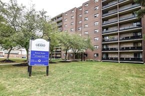 Kitchener apartment for rent - A sign in front of a building that says Grand Renewal Suites.