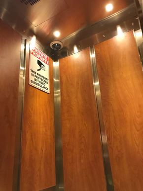 Hamilton apartment for rent - A sign on a door warning that the property is under surveillance.
