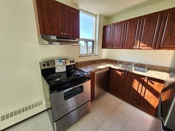 Kitchener apartment for rent - A kitchen with a stove and sink.