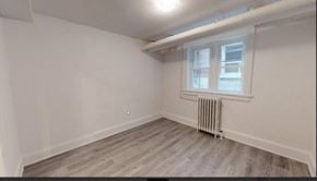 Kitchener apartment for rent - A room with a window and a radiator on the floor.