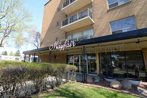 Hamilton apartment for rent - The exterior of a building with the name "Mayfair" on it.