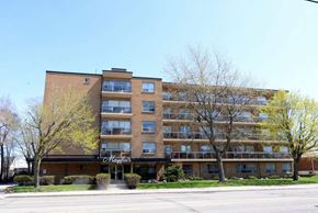 Hamilton apartment for rent - A large apartment building with the name "Maple" on the front.