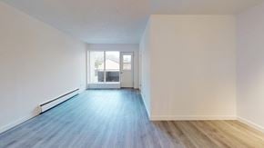Kitchener apartment for rent - A room with a blue floor and white walls.