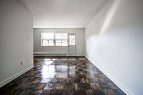 Stoney Creek apartment for rent - A room with a wooden floor and a window.