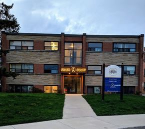 Dundas apartment for rent - The Osler Court building is a modern structure with a brick facade and a welcoming entrance.