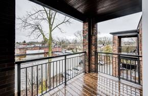 Hamilton apartment for rent - A balcony with a view of a town.