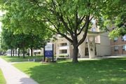 Hamilton apartment for rent - A tree stands in front of a building with a sign that says "Lafayette".