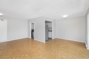 Burlington apartment for rent - A room with a wooden floor and white walls.