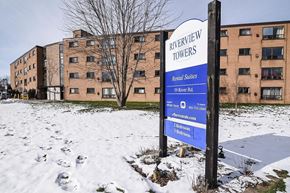 Welland apartment for rent - A sign for Riverview Towers stands in front of apartment buildings.