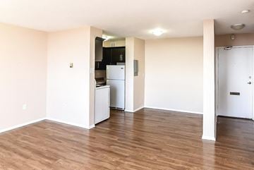 Stoney Creek apartment for rent - A kitchen area with a refrigerator and cabinets.