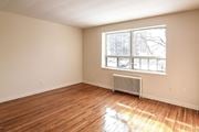 Hamilton apartment for rent - A room with a window and a radiator on the floor.
