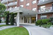 Stoney Creek apartment for rent - A red brick building with a white pillar in front.