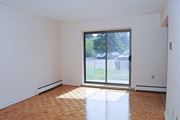 Stoney Creek apartment for rent - A room with a sliding glass door leading to a backyard.