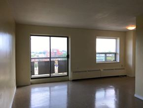 Hamilton apartment for rent - A room with a large window and a balcony.