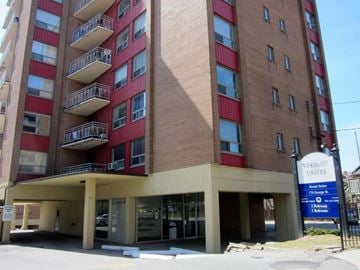 Hamilton apartment for rent - A tall building with a sign that says Westgate Towers.