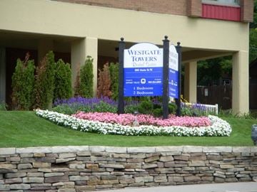 Hamilton apartment for rent - A sign for Westgate Towers is displayed in front of a building.