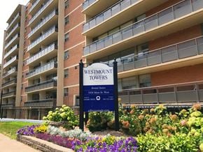 Hamilton apartment for rent - A sign for Westmount Towers stands in front of a building.