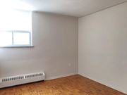 Hamilton apartment for rent - A room with a window and a radiator on the floor.