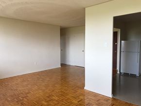 Hamilton apartment for rent - A room with wooden flooring and white walls.