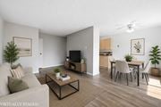 Hamilton apartment for rent - A living room with a couch, a coffee table, and a television.
