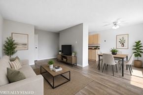 Hamilton apartment for rent - A living room with a couch, a coffee table, and a television.