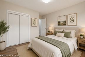 Hamilton apartment for rent - A bedroom with a bed, nightstands, and pictures on the wall.