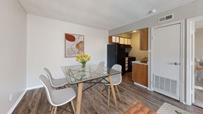Independence apartment for rent - A dining room with a glass table and chairs.