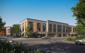 New Paltz apartment for rent - A modern building with a parking lot in front.