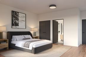 Beacon apartment for rent - A modern bedroom with a large bed and a painting on the wall.