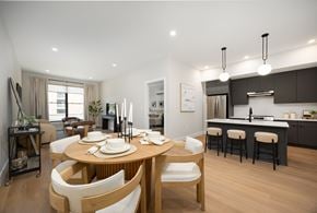 Beacon apartment for rent - A modern dining room with a wooden table and chairs.