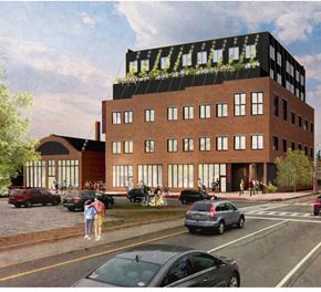 Poughkeepsie apartment for rent - A modern building with a green roof is depicted in the image.