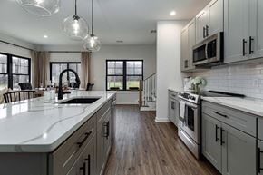 Poughkeepsie apartment for rent - A modern kitchen with a large island and stainless steel appliances.