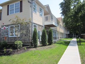 Poughkeepsie apartment for rent - A building with a sign that says "Baker" on it.