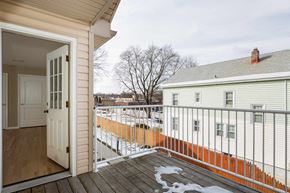 Poughkeepsie apartment for rent - A view from a deck looking at a white house.