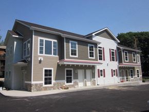 Poughkeepsie apartment for rent - A two-story house with a grey and white exterior.