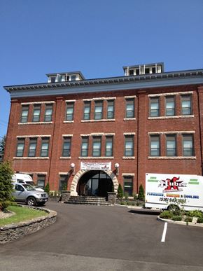 Catskill apartment for rent - A brick building with a sign in front that says "Clubs".