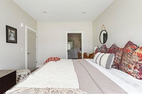 Marlboro apartment for rent - A bedroom with a large bed and a mirror on the wall.