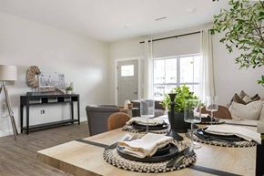 Marlboro apartment for rent - A dining table set with plates and glasses is in the foreground of a modern dining room.
